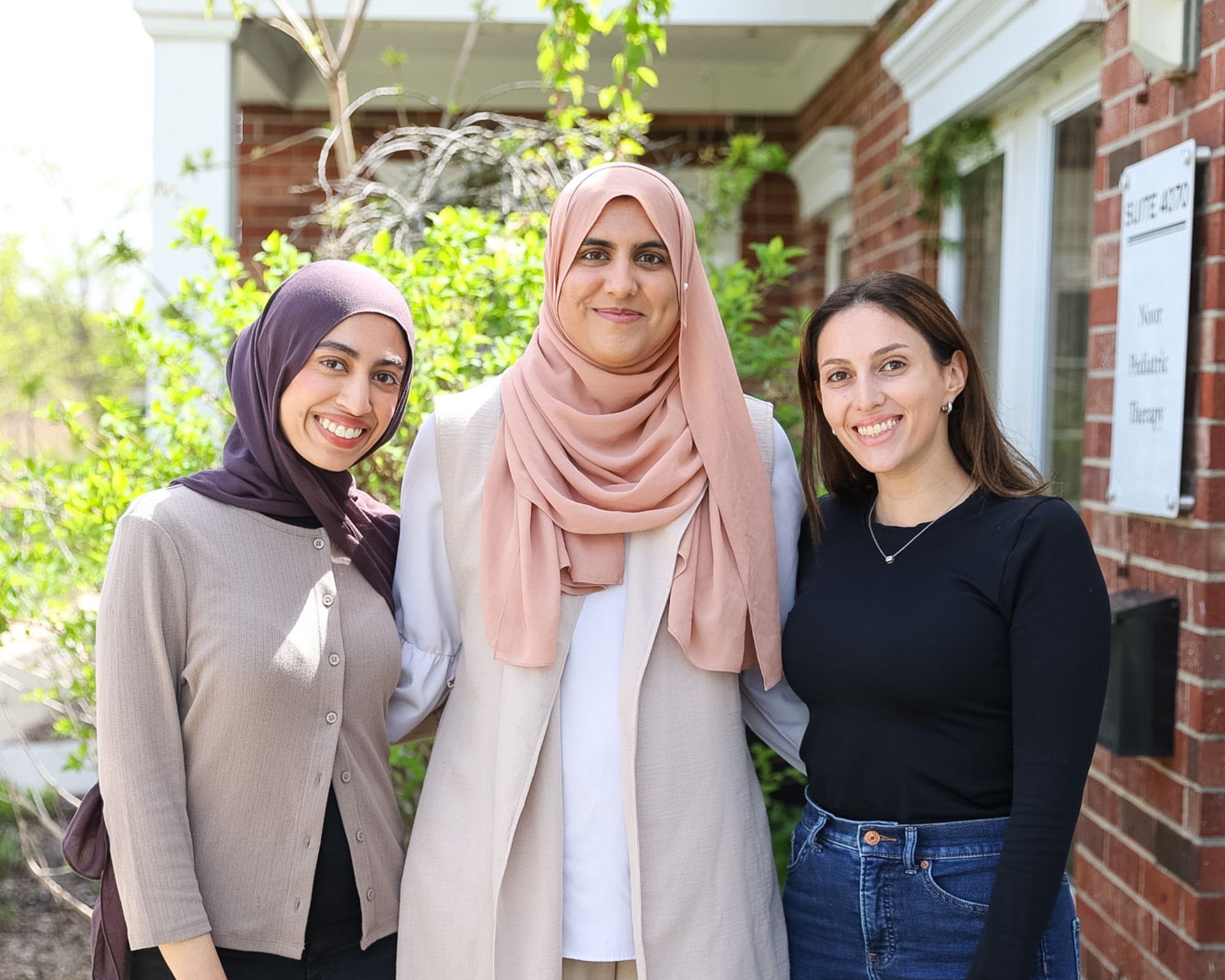 The Noor Pediatric Therapy team — Sarah Ahmed (OTR/L), Izabelle Brekher (CCC-SLP), and Namirah Malik (OTR/L) — pediatric occupational and speech therapists in South Barrington, Illinois